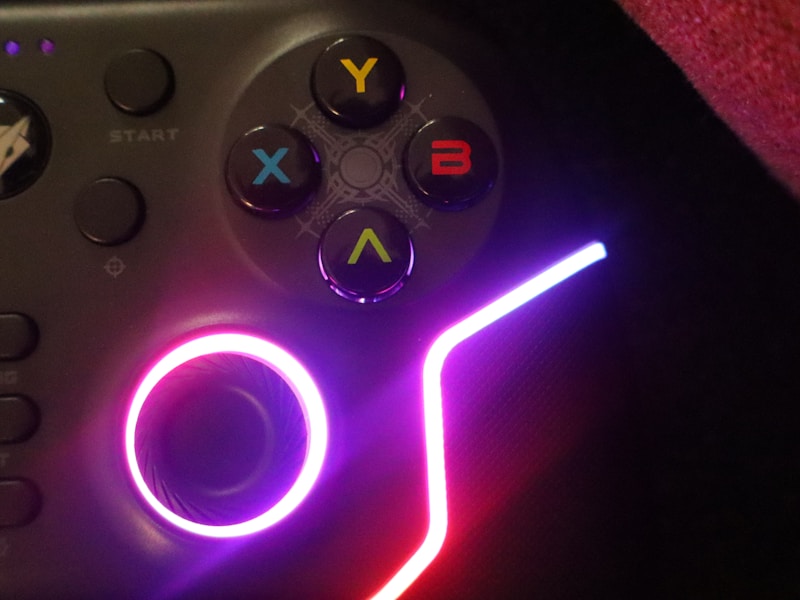 Three friends playing games together on a sofa